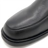 Men's black genuine leather boots close-up showing quality craftsmanship